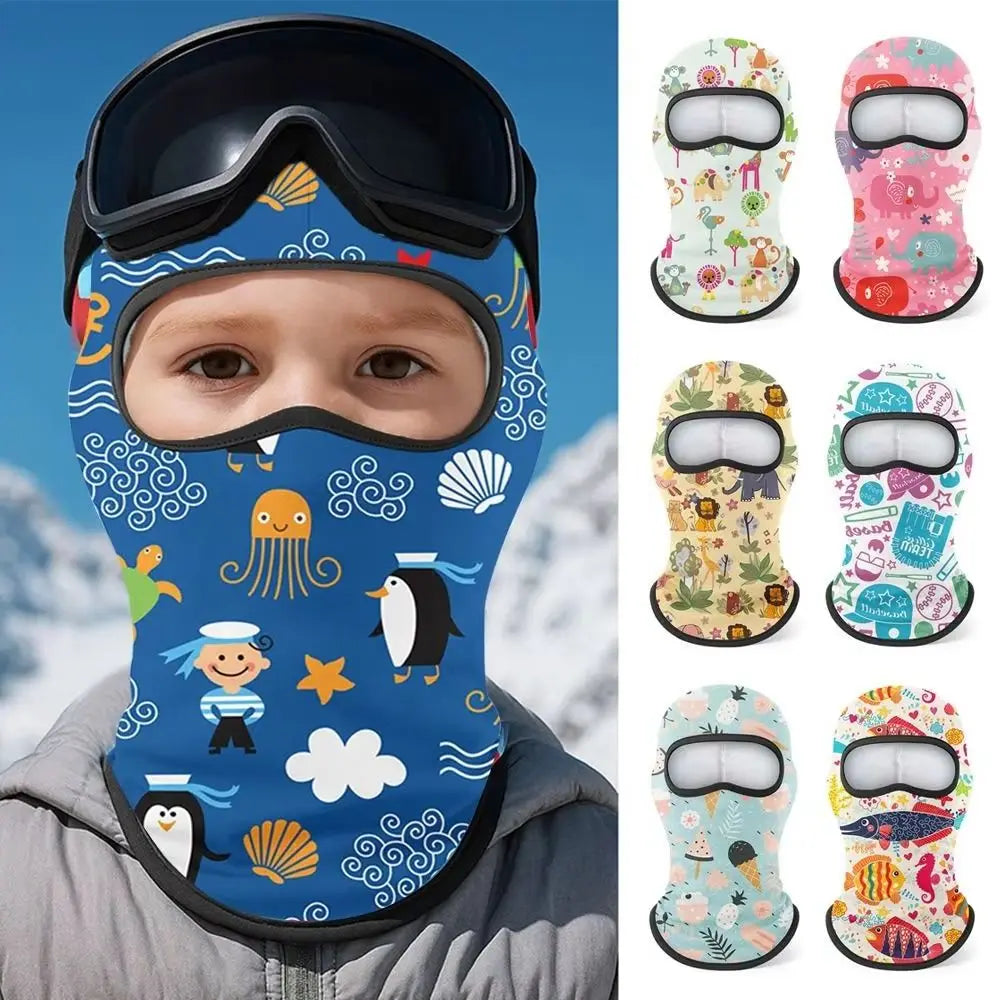 A child wearing a blue patterned balaclava mask with a white visor and black trim.