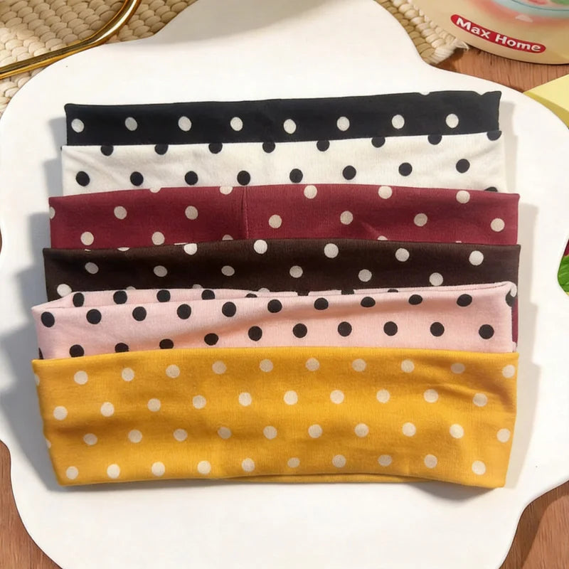 Collection de bandeaux pour la tête à pois larges dans les couleurs noir, blanc, marron, rose et jaune.
