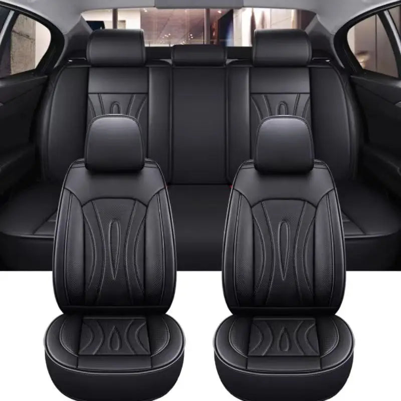Black full coverage PU leather car seat covers shown in a vehicle interior.