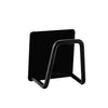 Black stainless steel wall-mounted sponge holder with a drain.