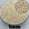 Close-up view of light beige decorative stone pebbles used for terrariums and aquariums, showing granular texture.