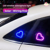 LED window atmosphere light featuring neon heart shapes illuminating a car window.