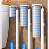Various sizes of disposable toilet brush kits with wall-mounted holders shown in a display tray.
