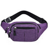 Purple canvas waist pack with black trim and zipper pockets shown from above