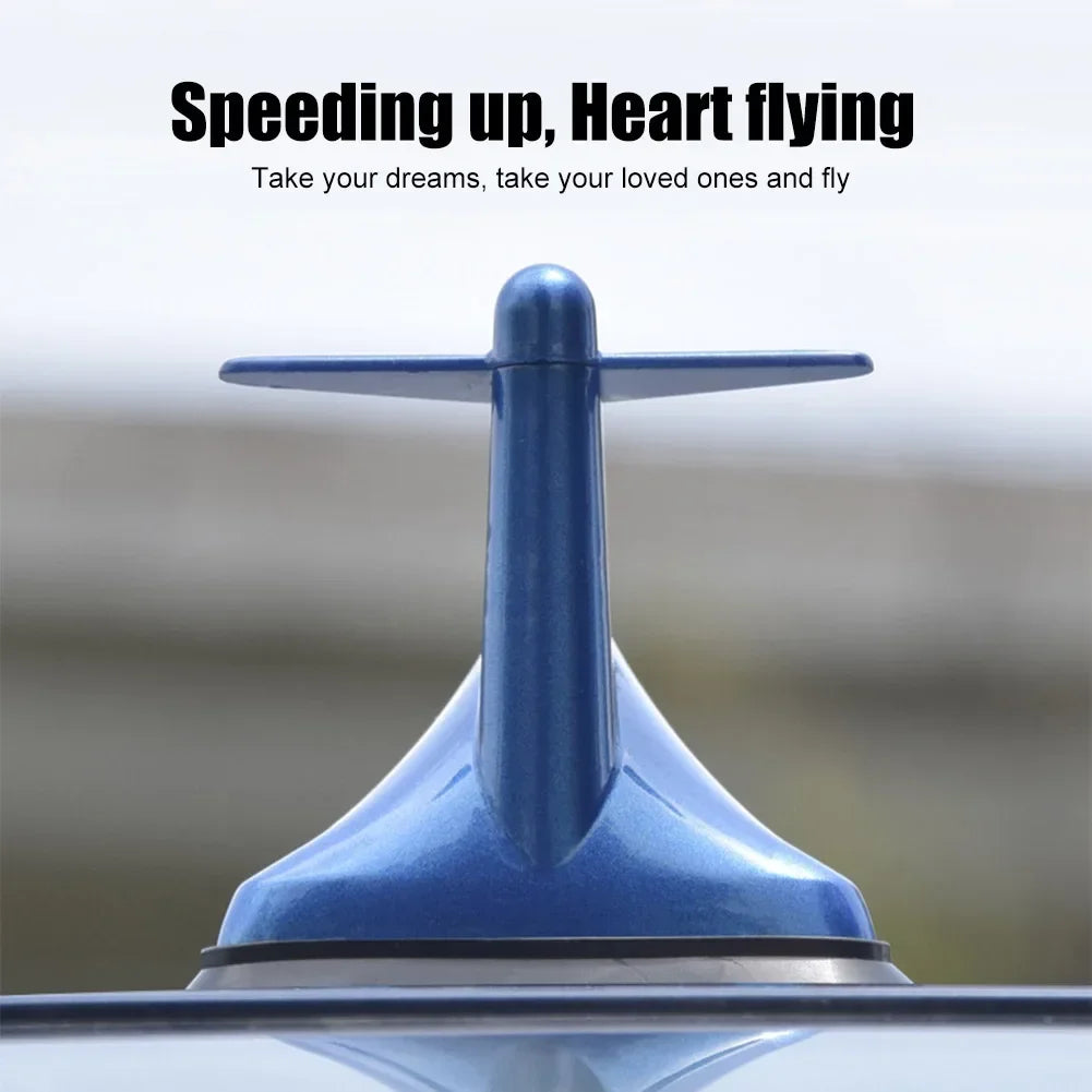 A blue shark fin car antenna signal booster is shown mounted on a vehicle's roof.
