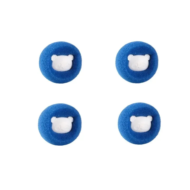 Four blue laundry balls with white pet hair remover inserts shown from above.