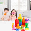 A collection of colorful screw and nut building blocks, including orange, pink, green, yellow, and red pieces.