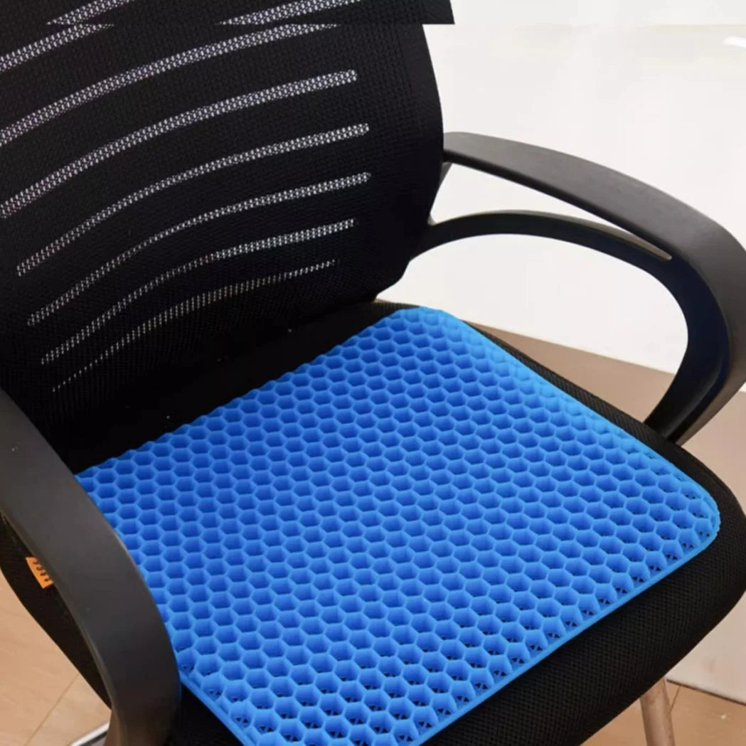 A black chair with a blue honeycomb silicone seat cushion for pressure relief.