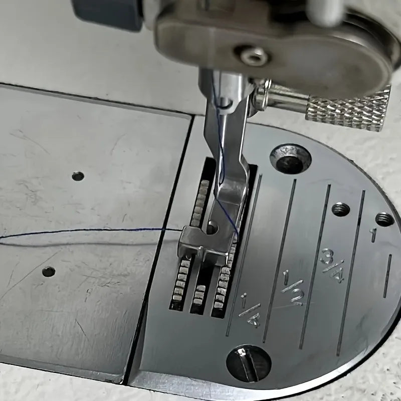 Close-up view of a stainless steel invisible zipper presser foot being inserted into a sewing machine.