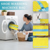 A woman is placing a yellow shoe washing machine bag into a white washing machine drum.