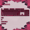 A close-up view of a red mechanical keyboard featuring an Iceberg theme and RGB lighting.