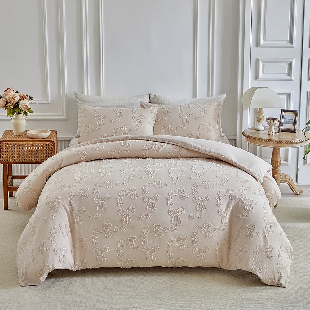 A beige Nordic leaf print duvet cover set displayed on a bed with white molding and light-colored bedding.