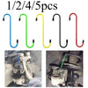 Five pieces of brake caliper hanger S-hooks in blue, green, yellow, and red for auto repair