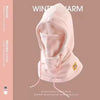 Pink winter balaclava with a hood and mask shown against a beige background.