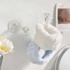 White and blue absorbent microfiber wrist washing bands with a glass dropper attached