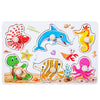 A wooden peg puzzle set featuring various colorful sea creatures and animals for toddlers.