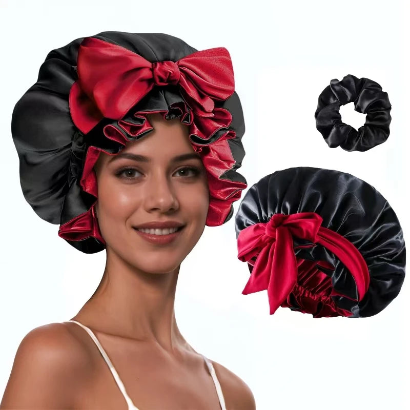 A woman models a black silk satin sleep bonnet with a red bow, shown alongside the separate fabric and a hair tie.