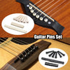 A set of guitar pins including strings, capo, and picks shown on a dark guitar neck.