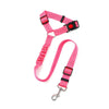 A bright pink adjustable reflective dog car safety harness with a black headrest strap and metal clip.