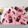 A pink throw blanket featuring a repeating pattern of Dr. Pepper bottles with pink ribbons.