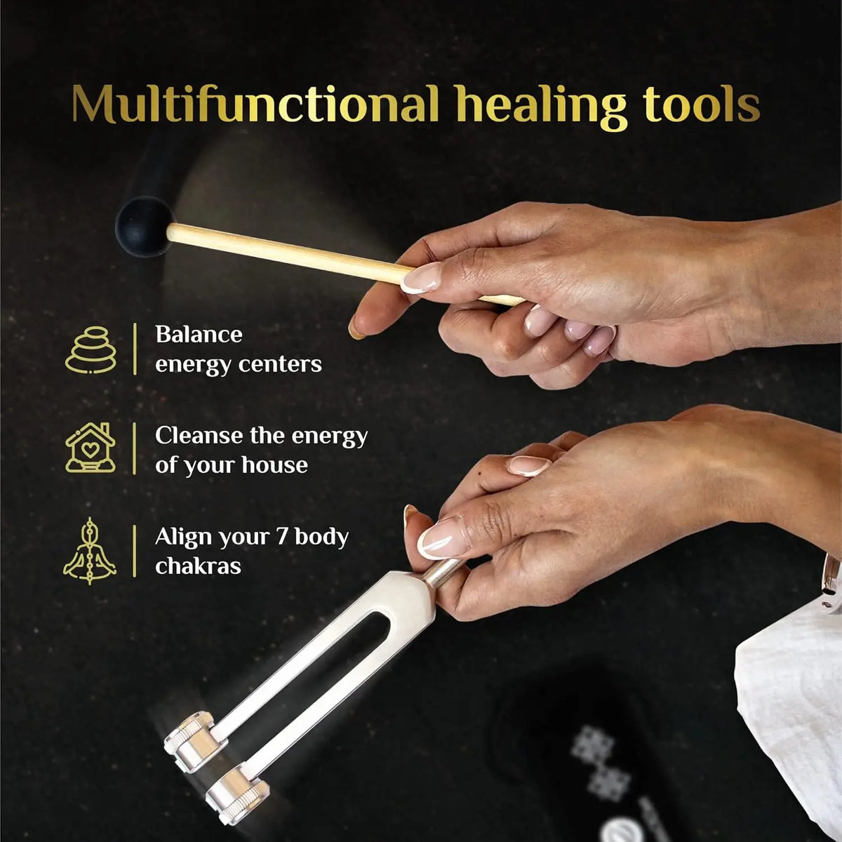 Hands hold a wooden tuning fork and a metal tool used for healing and energy work.