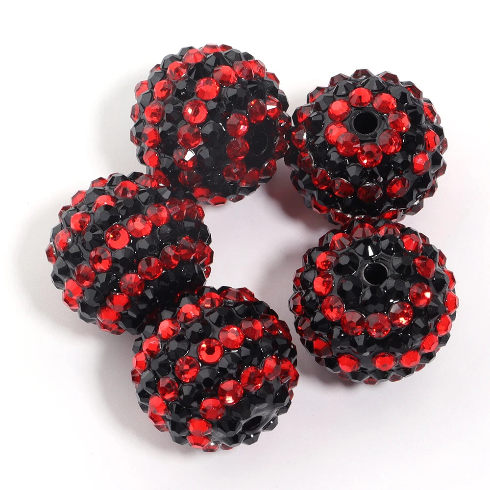 A set of five black and red resin rhinestone beads with a two-tone striped design.