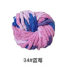 A ball of chunky acrylic yarn in shades of pink, blue, and purple for knitting and crochet.