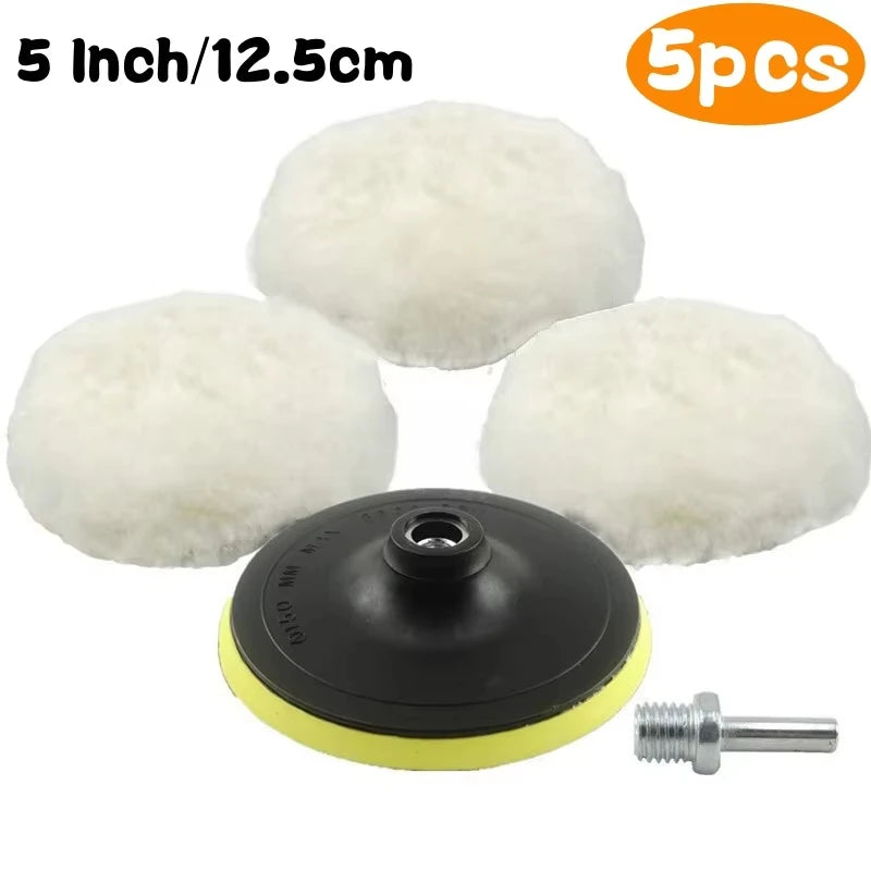 Five white wool car polishing pads with black backing pads and a drill adapter