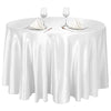 Elegant satin round tablecloth set with glassware and silverware for events