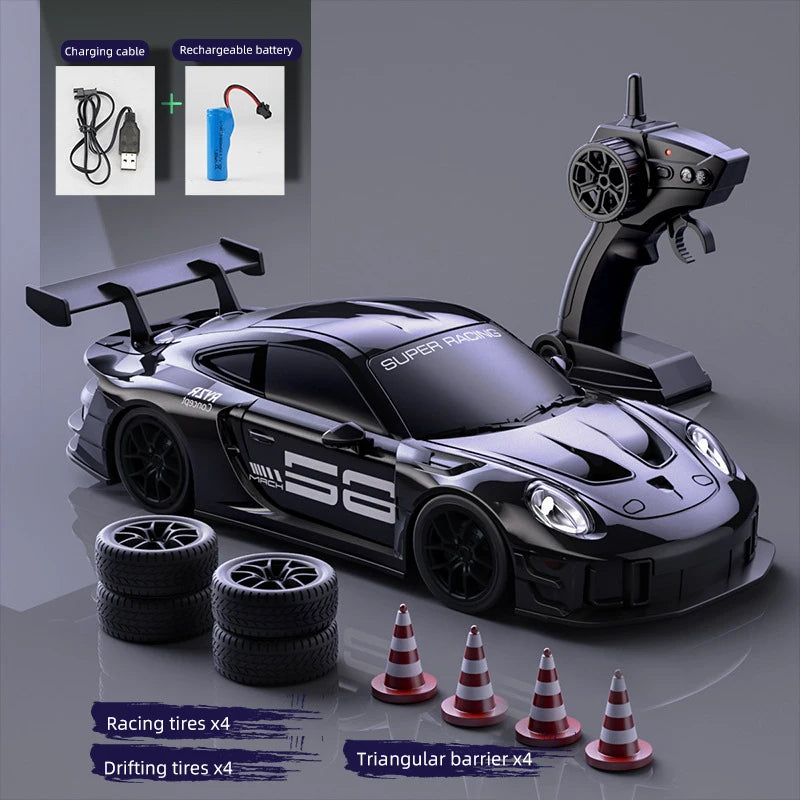 A black RC drift truck is shown with racing tires and a triangular barrier, alongside charging cables and a rechargeable batt