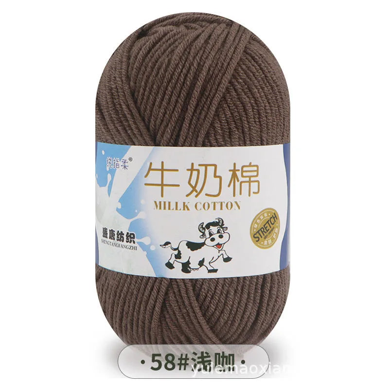 A skein of brown milk cotton blend yarn labeled with Chinese and English text, showing the thread for knitting or crochet.