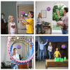 A man is playing a magic flying ball with LED lights inside a room.