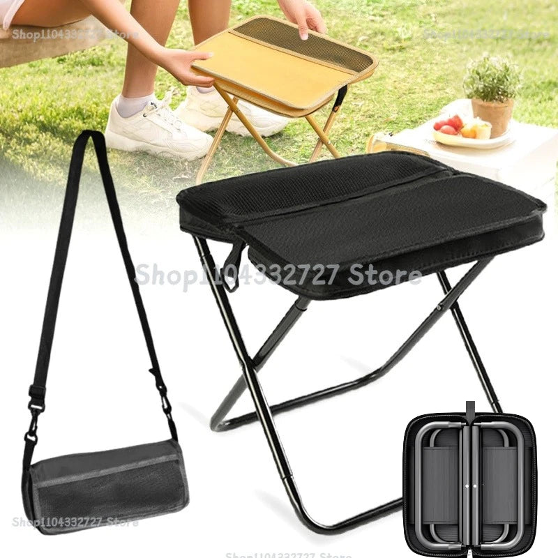 Black portable folding stool with a carrying strap and a folding metal frame.