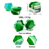 A flexible silicone travel jar in green with a honeycomb texture, shown from the side and showing front and bottom views.