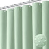 A row of light green waffle textured shower curtain rings hanging from a metal rod.