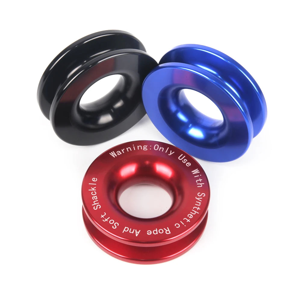 Three colored recovery rings, including black, blue, and red, for winch use with synthetic rope and shackle.