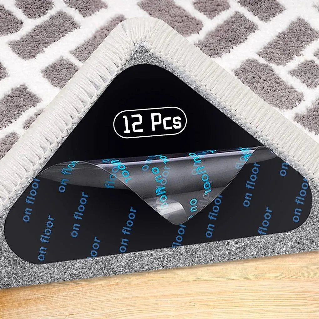 A triangular product display showing twelve reusable non-slip rug grippers packaged in a clear plastic holder.