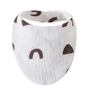White organic cotton muslin baby bibs with a textured fabric and dark brown animal print shapes