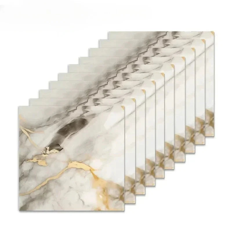 A row of rectangular marble wall tiles featuring white and gold veining, displayed at an angle.