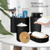 Matte black bathroom accessories set featuring a soap dispenser, brush, and soap bar on a white table.