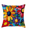 A decorative pillow featuring a vibrant floral print with orange, yellow, and pink flowers on a blue background.