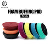 A set of foam buffing pads in various colors including red, purple, yellow, black, blue, and green for car detailing.