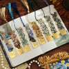 Vintage metal bookmark with artistic hollow design featuring floral patterns and a tassel