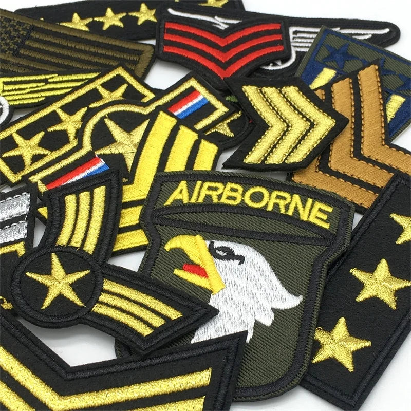 A collection of tactical embroidered patches featuring military rank insignia and emblems.