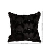 Black throw pillow cover featuring a pattern of Halloween ghosts and pumpkins