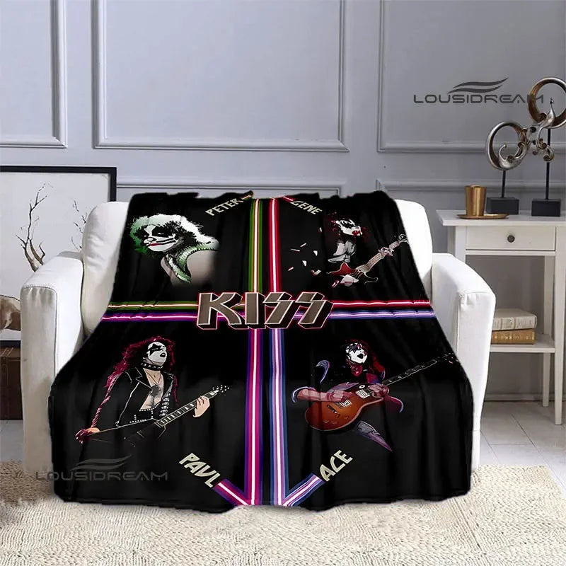 Black flannel throw blanket featuring various designs of the Kiss band members