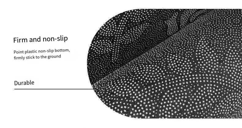 Close-up view of a black geometric non-slip rug texture showing firm grip and durability.
