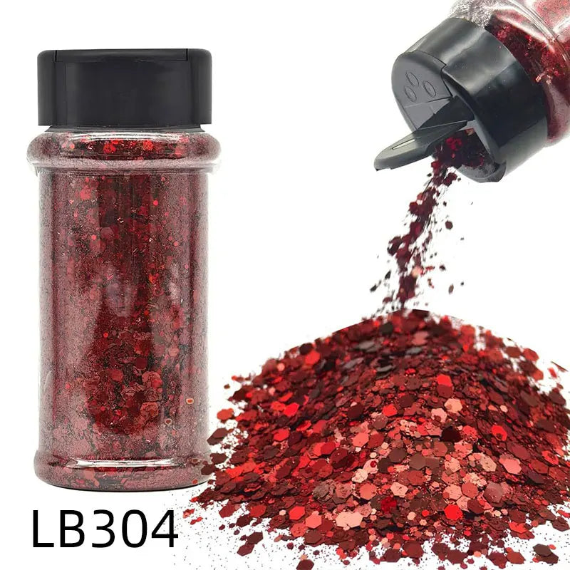 A glass jar of red glitter and a hand shaking more red glitter onto a surface.