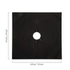 Black reusable non-stick gas stove protector mat with a central hole.