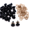 A collection of black safety noses and corresponding washers for crafting and stuffed animals